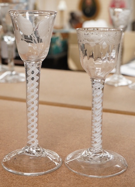 Two 18th century DSOT cordial glasses, one bowl engraved with roses, the other with swag decoration, tallest 16.5cm